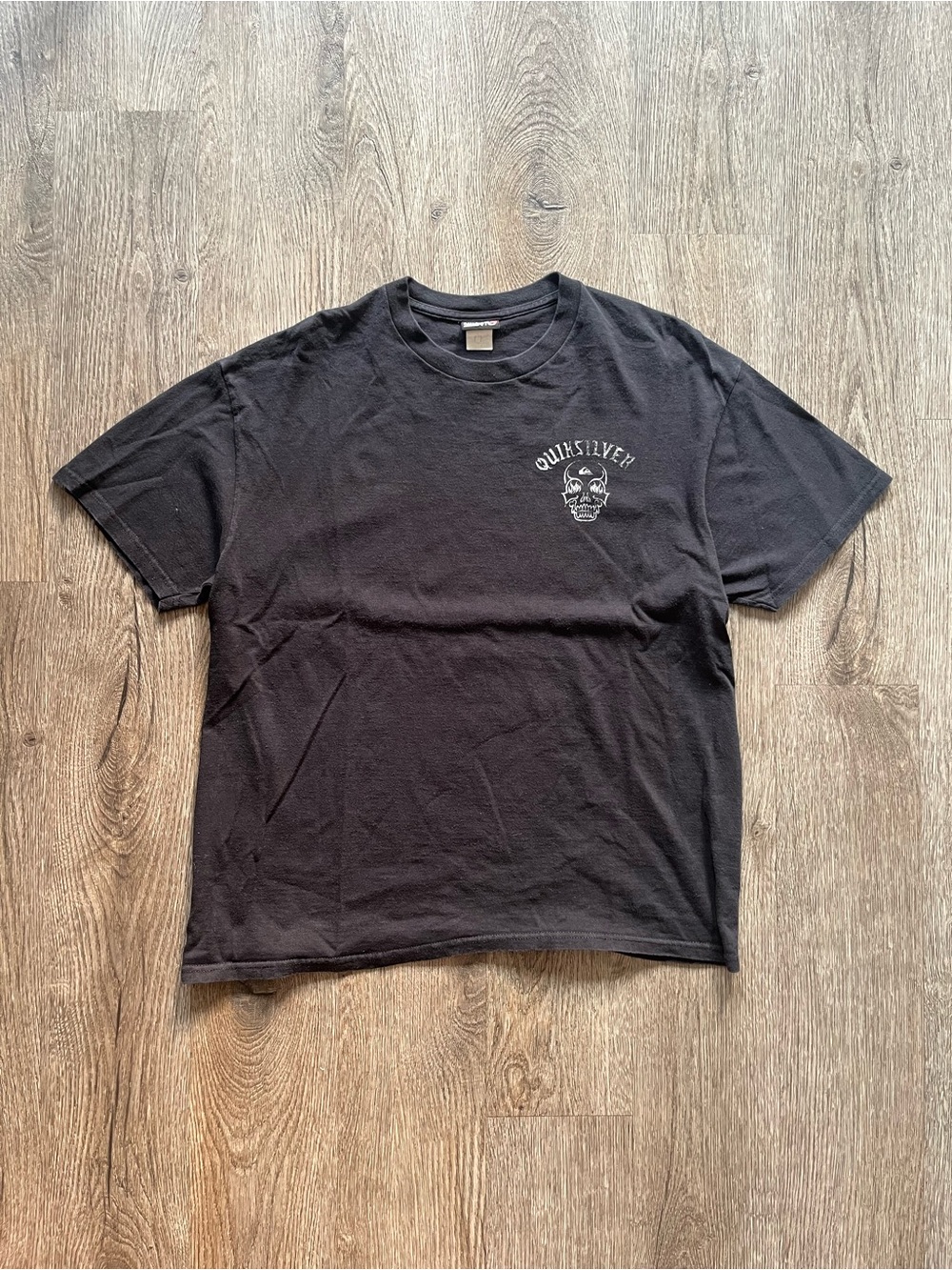 Quiksilver Black Short Sleeve Tee with Small Skull Graphic